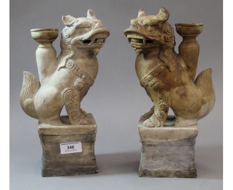 A pair of Chinese pottery dog-of-fo incense holders