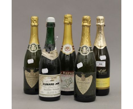 Five bottles of various sparkling wine