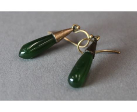 A pair of 1930s rose gold and jade earrings 