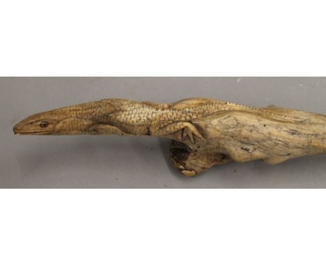 A carved walking stick, the handle worked with a lizard. 127 cm long