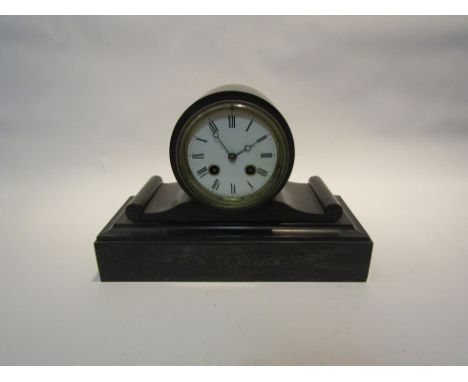 A late Victorian black and white slate mantel clock, with black Roman numerals to the white enamelled face, the 8-day movemen