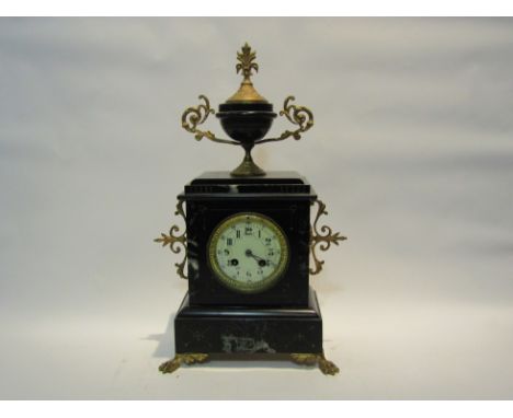  A late Victorian black slate and veined marble cased mantel clock, with black Arabic numerals to the cream face, the 8-day m