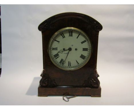 A 19th Century walnut cased bracket clock of arched form, with black Roman numerals to the 20cm diameter cream enamelled face