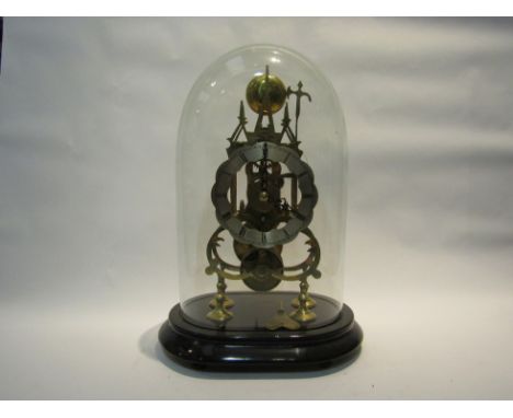 A Victorian brass skeleton clock, with black Roman numerals to the scalloped silvered chapter ring, the single fuse movement 