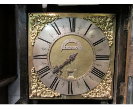 A late 17th/ early 18th Century longcase clock, the square brass face with 23cm diameter silvered chapter ring enclosing a ca