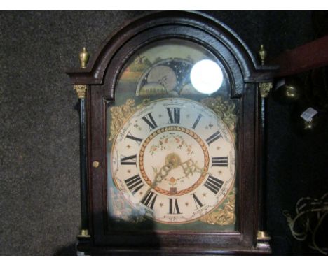 A mid-19th Century Continental wall clock, with black Roman numerals to the 25cm diameter dial, enclosing a calendar aperture