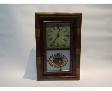 A late 19th Century wall clock by Seth Thomas, with black Roman numerals to the cream square face, the 8-day movement hung wi