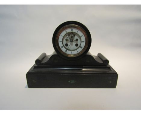 A Victorian black slate mantel clock, with black Roman numerals to the white enamelled chapter ring enclosing a visible Broco