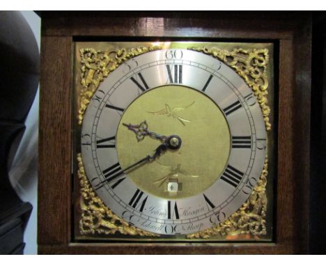 An early 19th Century East Anglian longcase clock case, the later replaced square brass face with pierced spandrels, black Ro