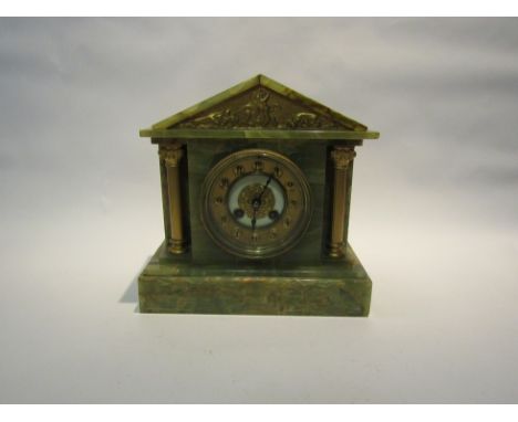 A late Victorian green onyx cased mantel clock, with black Arabic numerals to the gilded chapter ring, the 8-day movement str