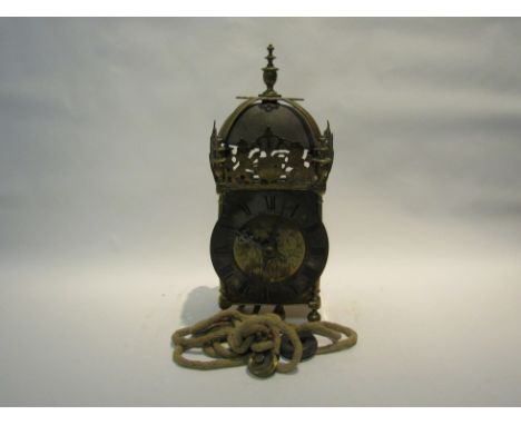 An early 19th Century lantern clock, with black Roman numerals to the 15cm diameter brass chapter ring, named "Thomas Parker 