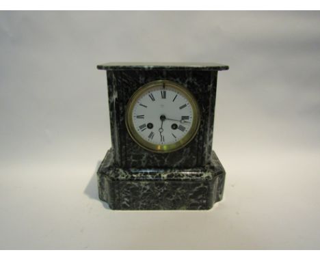 A late Victorian black and white variegated marble mantel clock, with black Roman numerals to the white enamelled face, the 8