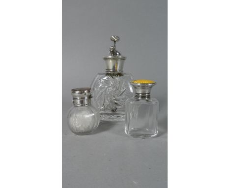 A Silver Topped Glass Perfume Atomiser (Birmingham 1931), a Silver and Enamel Top Scent Bottle (Birmingham 1924) and a Silver