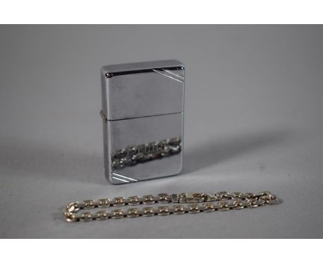 A Vintage Zippo Lighter Inscribed 'Dennis' Together with a Silver Bracelet Stamped 925 (We Cannot and will not post Lighters)