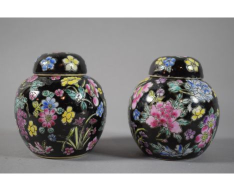 A Pair of Small 20th Century Chinese Ginger Jars and Covers Having Polychrome Enamel Floral Decoration on Black Ground, 10cm 