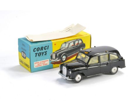 Corgi No. 418 Austin Taxi. Black with lemon interior. Excellent with very little sign of wear in excellent box (including lea