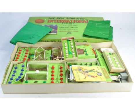 A collection of playworn Subbuteo comprising International Box and assorted contents as shown. Several teams and other figure