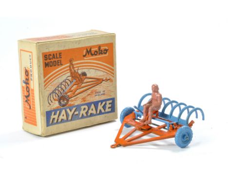 Moko Hay-Rake comprising original rake in orange with blue tines and wheels. Lever mechanism lifts tines up or down. Original