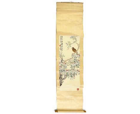 A Chinese hanging scroll,20th century, of a bird perched on a branch surrounded by berries and blossom, ink and colour on pap