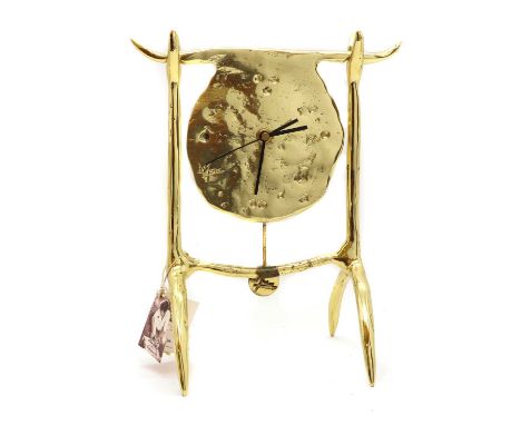 A David Marshall brass mantel timepiece,the movement resting on a twin support stand,30cm highCondition ReportHands slightly 