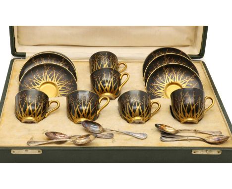 A Worcester coffee set,circa 1930s, in the Art Deco taste, each decorated with gilt blossoming branches to a black ground,cup