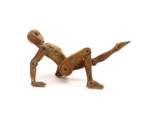An artist's mannequin figure, 20th century, with articulated limbs, remnants of paint, 38cm highCondition ReportSome knocks t