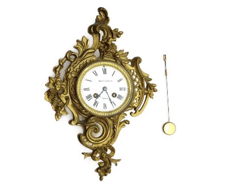 A French cartel clock,19th century, by Henry-Lepaute Paris, the enamel dial with Roman numerals, minute track and bell strike