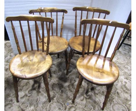 A set of four Swedish stick back kitchen chairs