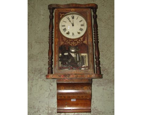 A 19th century wall clock with straw work marquetry detail and turned column supports, together with an art deco three train 
