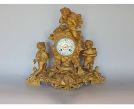 Late 19th century French gilt spelter figural mantle clock fitted with a decorative enamelled dial with cabochon enamelled Ro