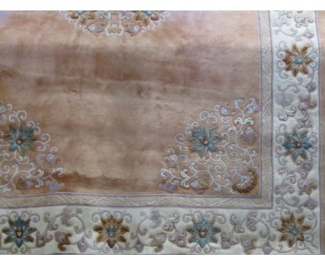 Large Chinese wool carpet decorated with typical floral sprays upon a peach/orange ground, 380 x 270cm 