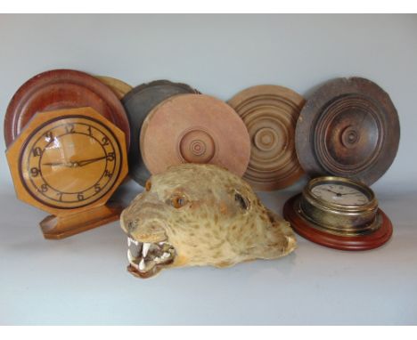A mixed lot to include an antique taxidermy study of a cheetah head, a metamic quartz bulk head type clock and others