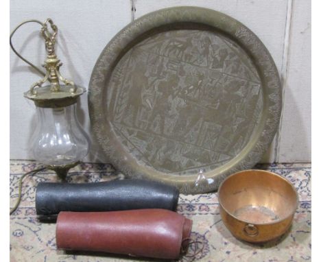 A miscellaneous collection including an Egyptian brass tray, various light fittings in brass, brass stair rods, leather gaite