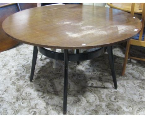 A 1960s teak wood and ebonised dining set comprising a circular table and four matching stick back chairs (E Gomme early G pl