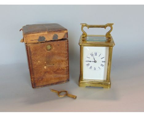 A brass cased carriage clock, striking on a gong with original Moroccan carry case, 11.5 cm high, key 
