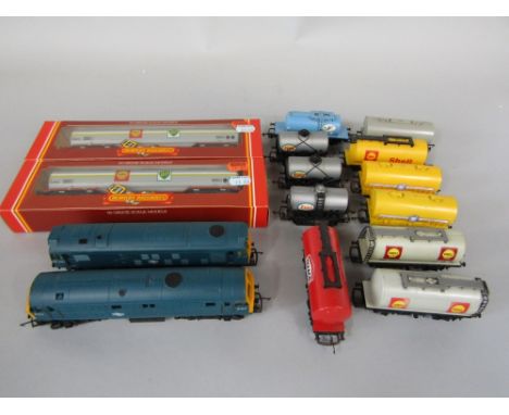 A Hornby 0 gauge 6124 coupling engine, together with a Hornby 25-147 engine and thirteen various wagons