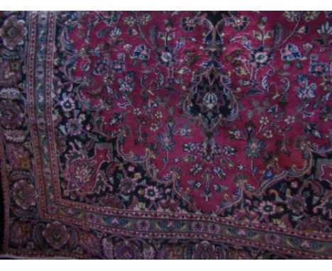 Persian Kashan carpet with traditional design, washed red ground, 275 x 175cm