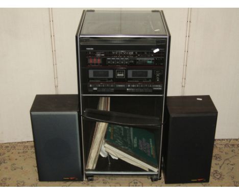 A Toshiba stereo sound system model SL-7, with record deck, twin cassette, synchro record system and original cabinet, Toshib