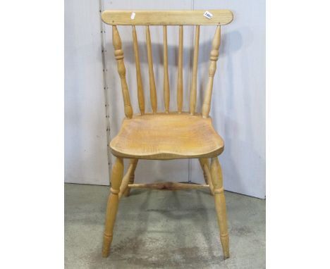 A contemporary Windsor stick back kitchen chair in ashwood with dished seat on turned supports