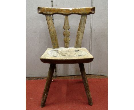 A primitive ashwood stick back dining chair, the single piece seat of dished form, with stick leg and simple shaped back