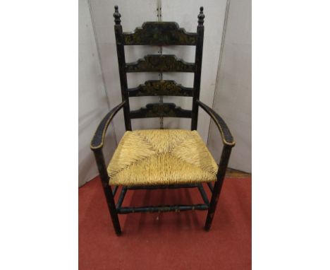 A 19th century Boston ladder back elbow chair with painted finish, the ladders with Regency style scrollwork detail, the cres