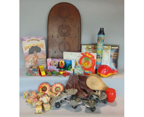 A mixed toy lot, to include many vintage examples to include tin plate toys, a bagatelle board, vintage dolls and games