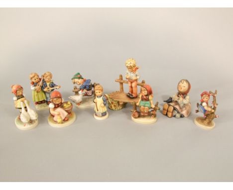 A collection of nine various Hummel figures