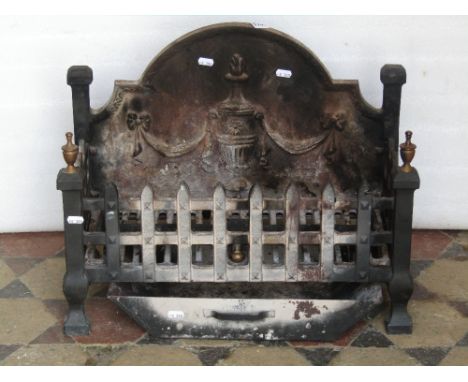 A small cast iron fire basket and combined arched fire back of rectangular form with relief classical urn, tie ribbon and swa