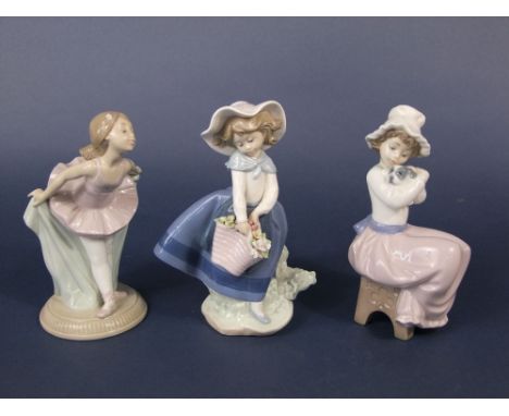 A Lladro Daisa figure of a girl with flower basket, together with two Nao figure groups