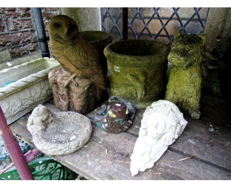 A pair of weathered contemporary cast composition stone garden planters of squat cylindrical form with classical repeating wi