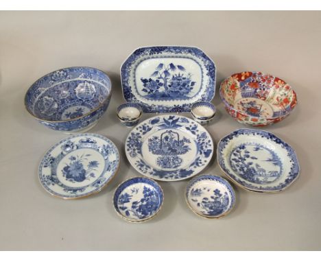 A collection of 19th century oriental blue and white ceramics including an oval meat plate, a pair of dishes with deer and tr