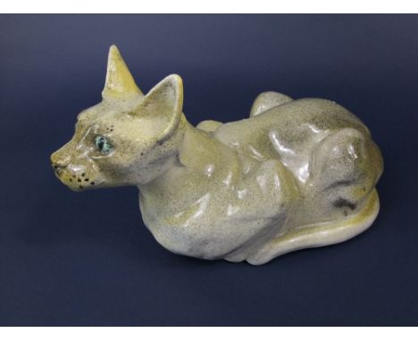An unusual studio pottery model of a crouching Siamese cat with label to base Sophie March? and dated 1981, 37cm long approx