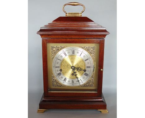 A good quality contemporary bracket type musical clock, with mahogany case fitted with a Franz Hermle musical movement