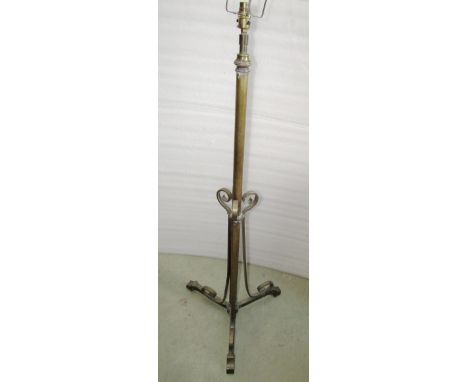 An art nouveau brass lamp standard with telescopic stem and associated hunting scene shade